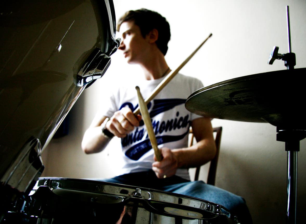 Oliver Terry sat at the drum kit during a drum lesson in Stockton.